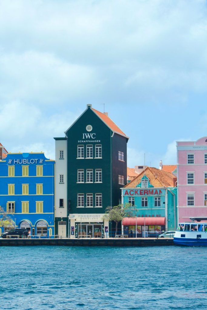 Discover the vibrant colonial architecture along the waterfront of Willemstad, Curaçao.